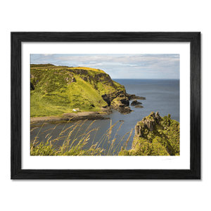 Secluded Coastal Cottage beneath Green Cliffs, Co. Antrim fine art photography print by Nua Photography