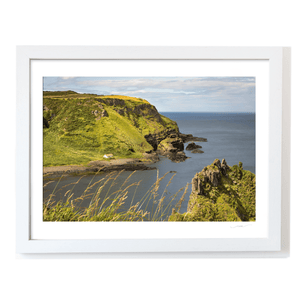 Secluded Coastal Cottage beneath Green Cliffs, Co. Antrim fine art photography print by Nua Photography