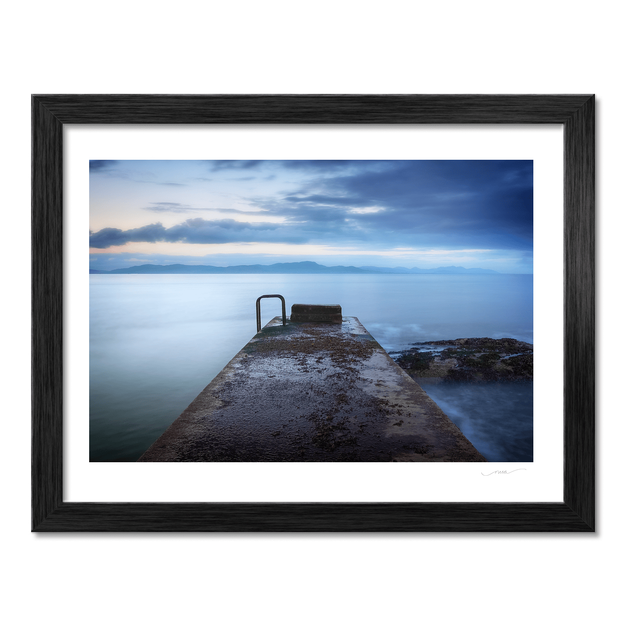 concrete-pier-calm-sea-mountains-dusk PM