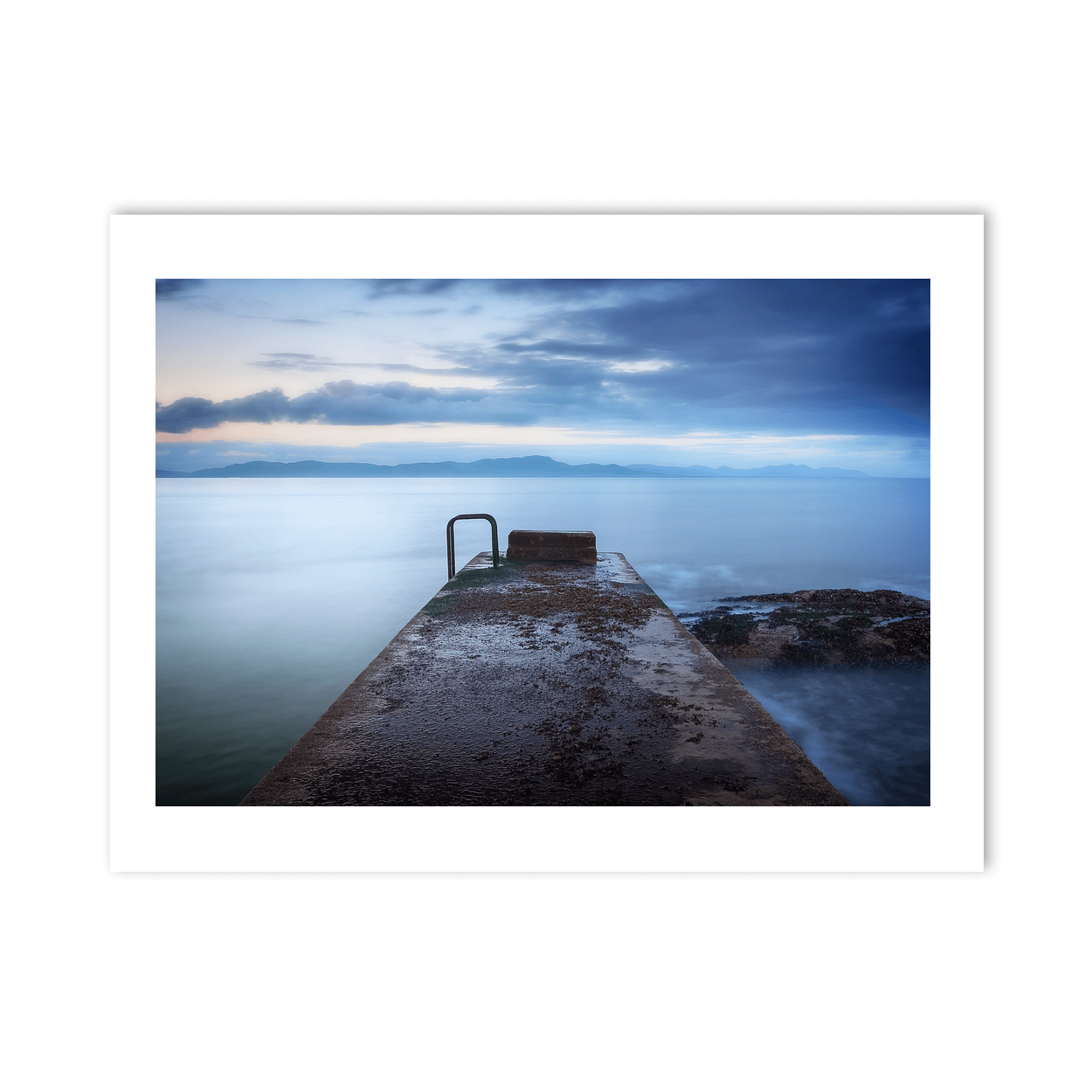 concrete-pier-calm-sea-mountains-dusk PM
