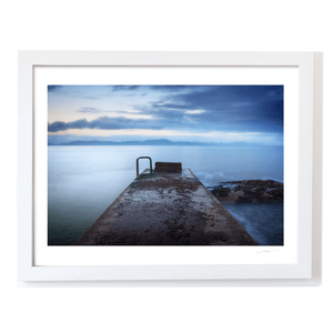 concrete-pier-calm-sea-mountains-dusk WF