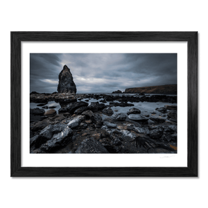 dramatic-sea-stack-rocky-shore-moody-skies BF