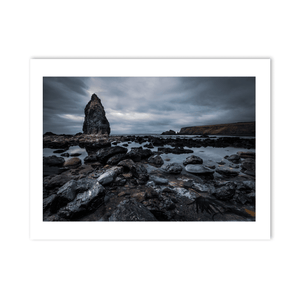 dramatic-sea-stack-rocky-shore-moody-skies PM