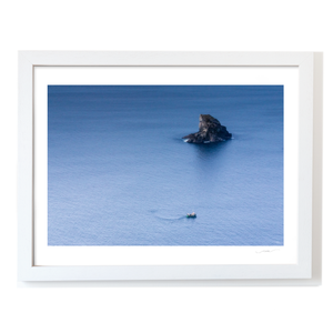fishing-boat-sea-stack-calm-atlantic-waters WF