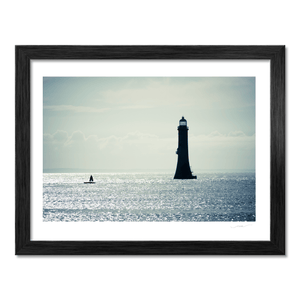 lighthouse-silhouette-shimmering-sea-down BF
