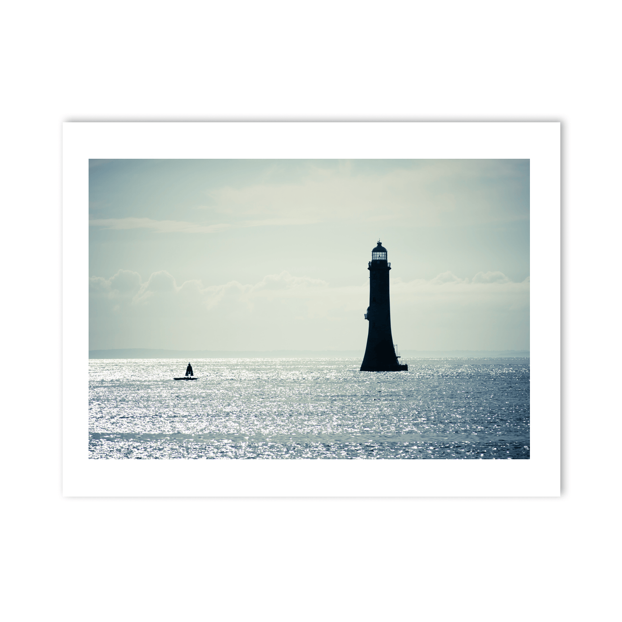 lighthouse-silhouette-shimmering-sea-down PM