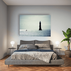 lighthouse-silhouette-shimmering-sea-down Pano