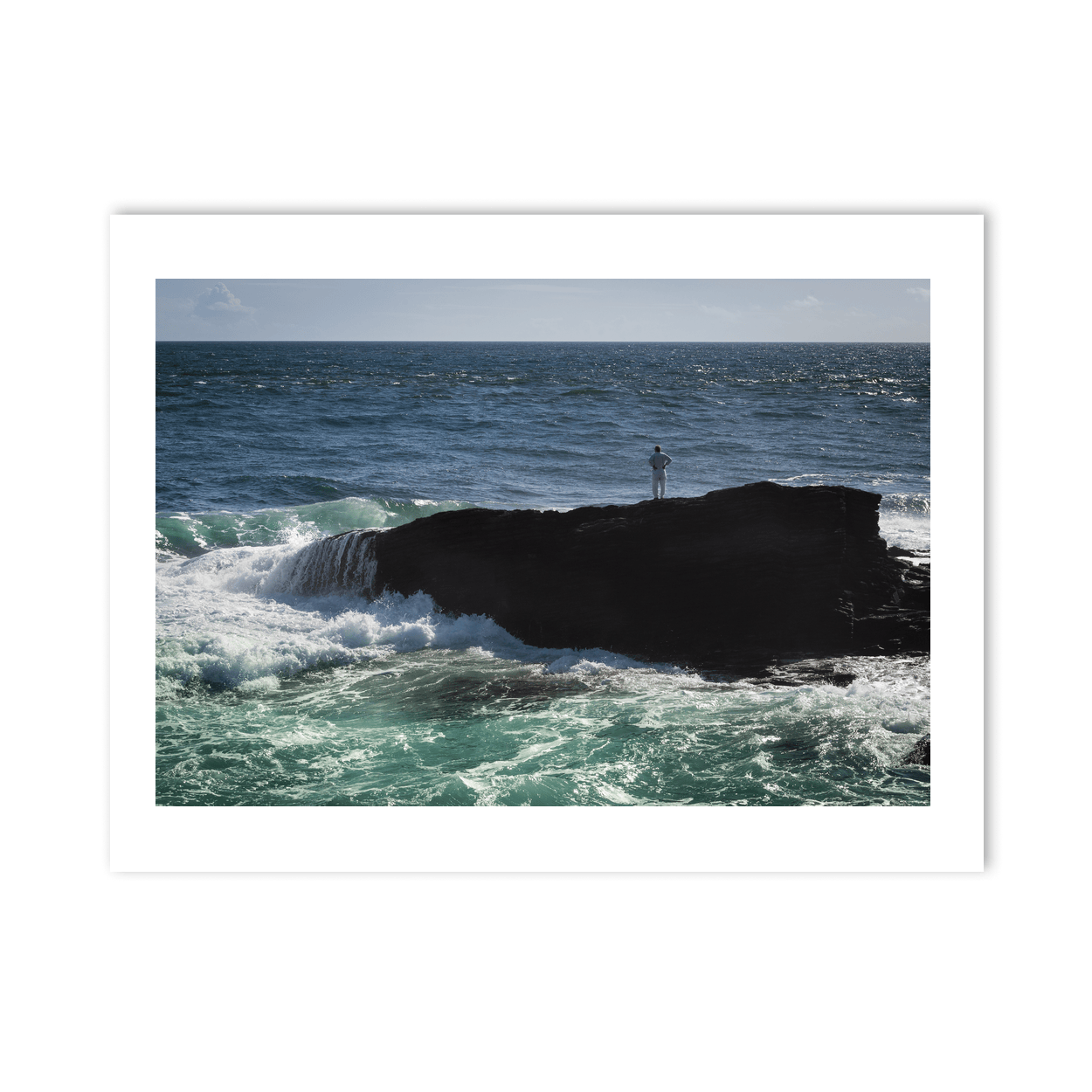 lone-figure-rock-outcrop-crashing-waves PM