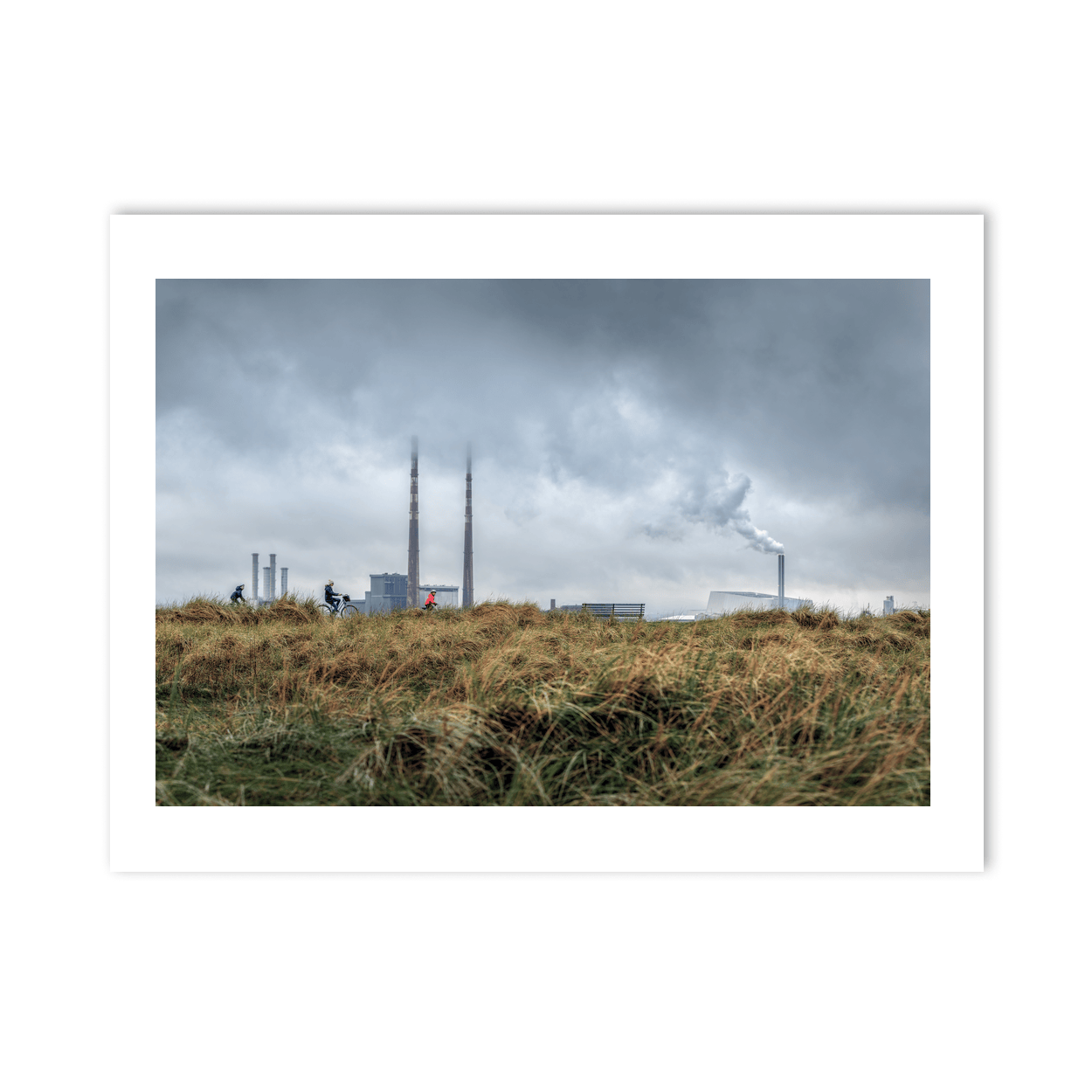 Nua Photography Print Poolbeg Chimneys and Cyclists Under Stormy Skies, Dublin City Poolbeg Chimneys Stormy Sky Dublin Print | Nua Photography