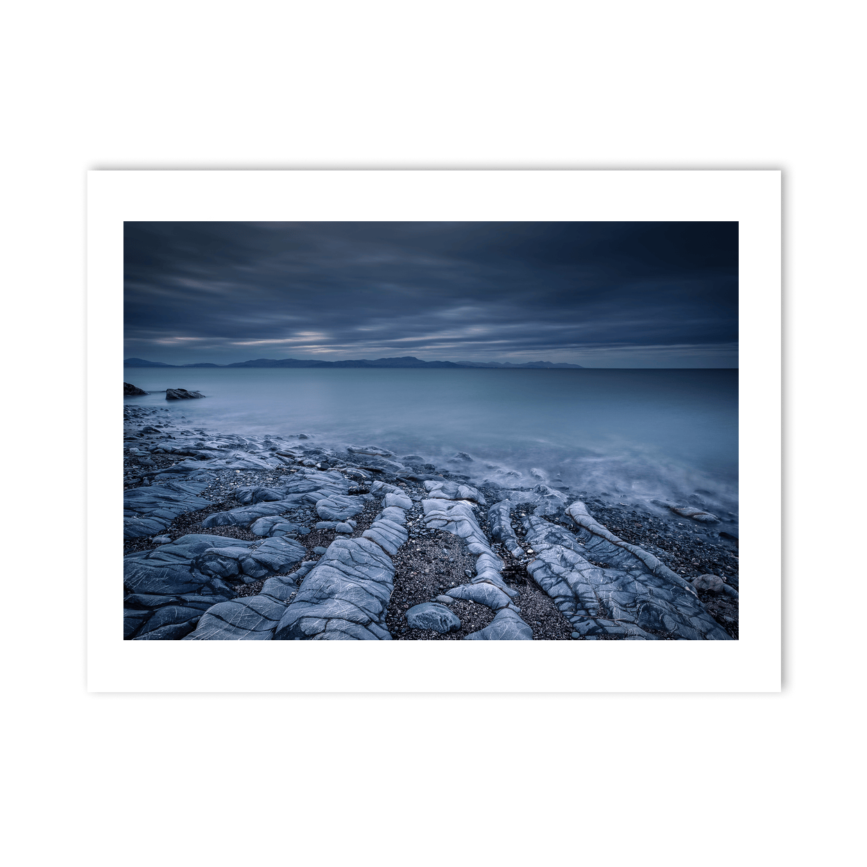 rocky-shoreline-misty-sea-moody-skies PM