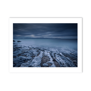 rocky-shoreline-misty-sea-moody-skies PM