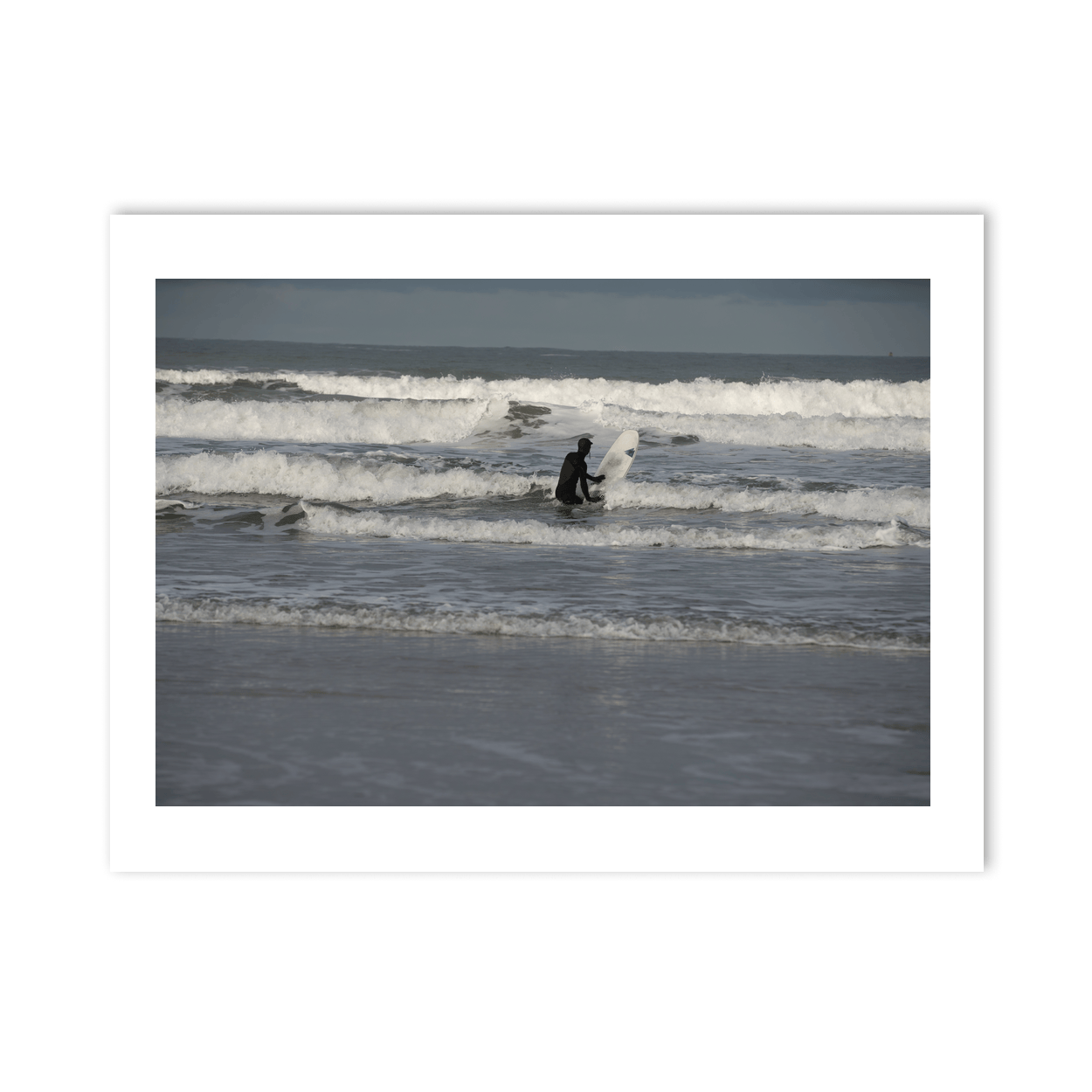 surfer-wading-into-waves-antrim-coast PM