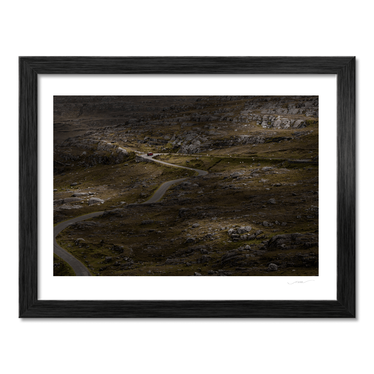 winding-road-through-rocky-moorland-red-van PM