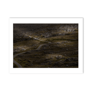 winding-road-through-rocky-moorland-red-van PM