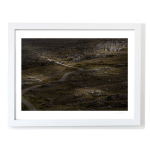 winding-road-through-rocky-moorland-red-van WF