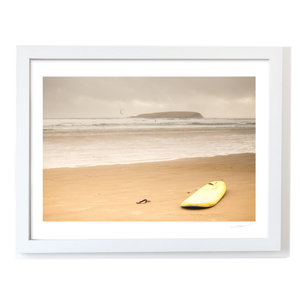 yellow-surfboard-sandy-beach-overcast-day WF